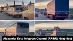 Russia - convoy of trucks and military vehicles, some of them with p.m.c. wagner flags on a highway in southern russia. undated