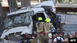 Israeli police and emergency responders recover the body of the truck driver at the site of a ramming attack in Ramat Hasharon, north of Tel Aviv on October 27, 2024.