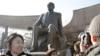 Kazakhstan -- People attend a ceremony to open the sculptural monument which includes the sculpture of President Nursultan Nazarbaev in Almaty, 11Nov2011