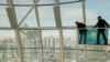 KAZAKHSTAN -- Employees attach a Kazakh state flag inside the monument Baiterek in central Nur-Sultan, November 28, 2019